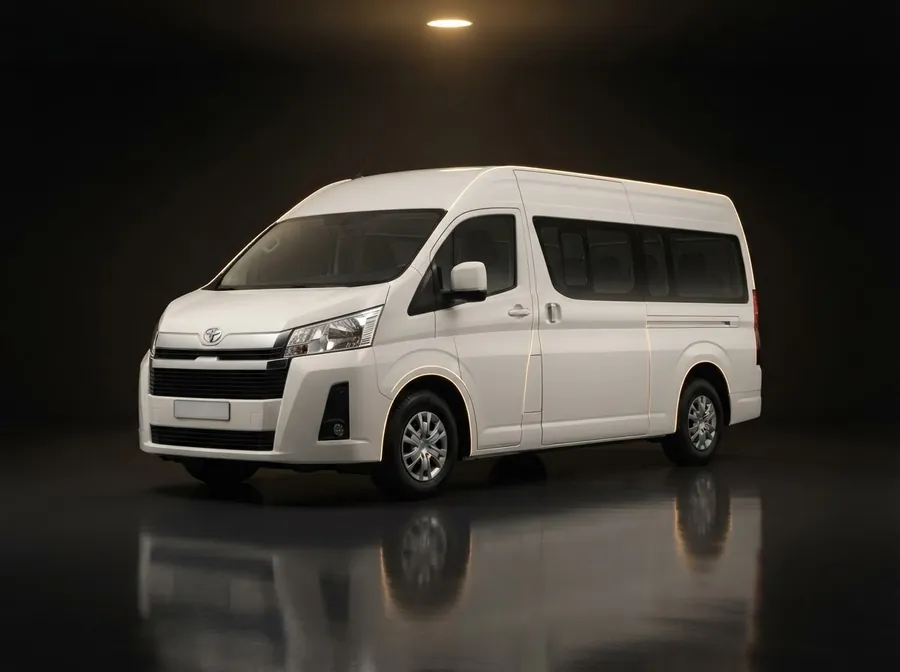 White Toyota Hiace high-roof van in a dark studio