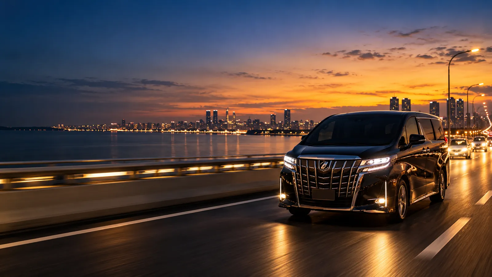 Black luxury MPV on the causeway bridge between Singapore and Johor Bahru at dusk